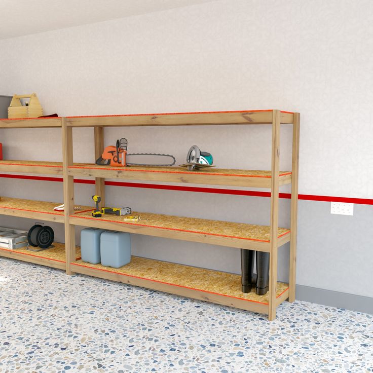 a room with shelves and tools on the floor