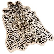 a white and black animal print area rug