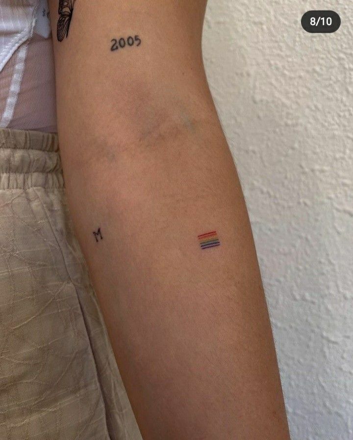 a person with a small tattoo on their arm