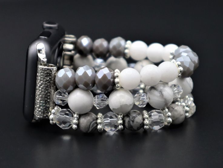 "This lovely beaded apple watch band is made from crystals, landscape, howlite gemstones, and silver-plated findings. Beads are 6mm to 10mm round, rondelle, faceted shapes. Total weight is 54 grams for 6\" long band. We design the watch band fits many smart watches as long as you select your watch type correctly. (38mm, 40mm, 41mm, 42mm, 44mm 45 mm Apple watches, Fitbit Versa 1 2 3 Sense Lite Ionic, Samsung Watch 4, 3 series Active 1-2 and more). There is no clasp, it has an elastic cord. Handcr Silver Adjustable Apple Watch Band With Round Beads, Samsung Watch, Tech Jewelry, Smart Jewelry, Apple Watches, Band Fits, Wearable Tech, Smart Watches, Metal Accessories