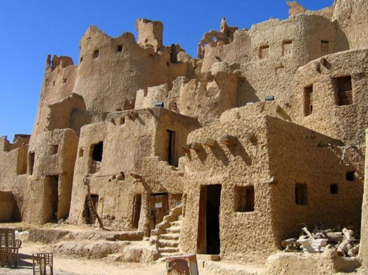 an old adobe building in the desert