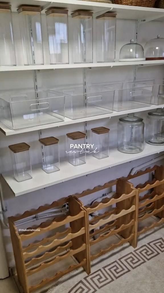 the shelves are filled with clear plastic containers