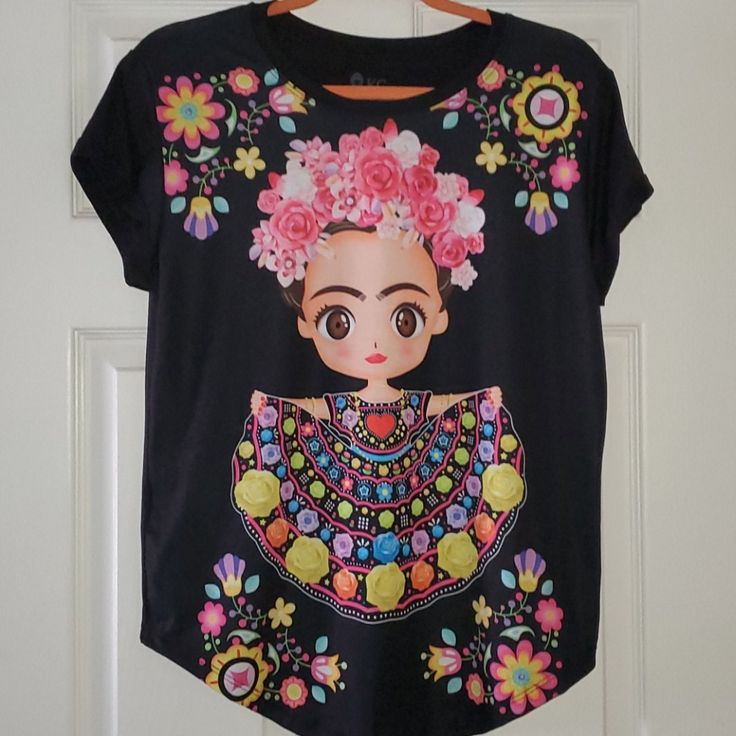 Brand New, Without Tags. This Fridita, Or Baby Frida Shirt Is Super Cute And Colorful. Top Is 100% Polyester And Has A Fair Amount Of Stretch To It. Shirt Is Made In Mexico. Comes From A Pet Free, Smoke Free Home. Thanks For Looking! Cute Black Printed Tops, Cute Black Short Sleeve Blouse, Cute Black Floral Print Tops, Frida Kahlo Shirt, Black Short Sleeve T-shirt For Day Of The Dead, Super Cute, Brand New, Womens Tops, Tops & Tees