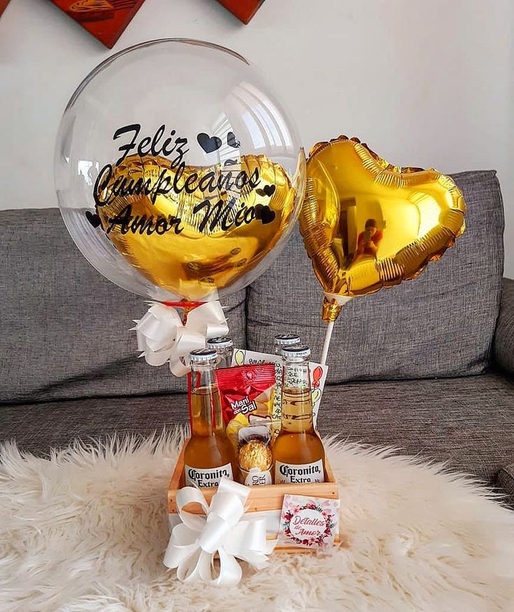 two balloons and some condiments on a couch