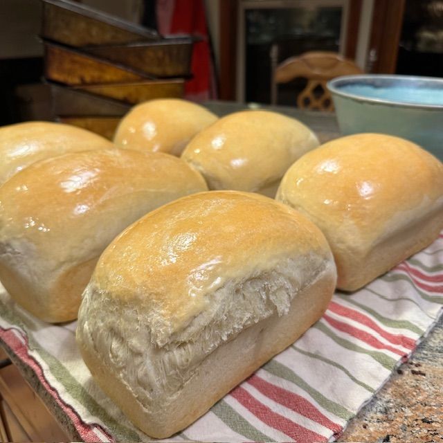 several loaves of bread sitting on top of a towel