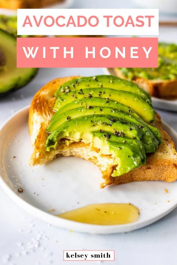 avocado toast with honey on a white plate