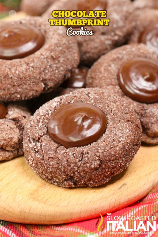 chocolate thumbprint cookies on a wooden plate