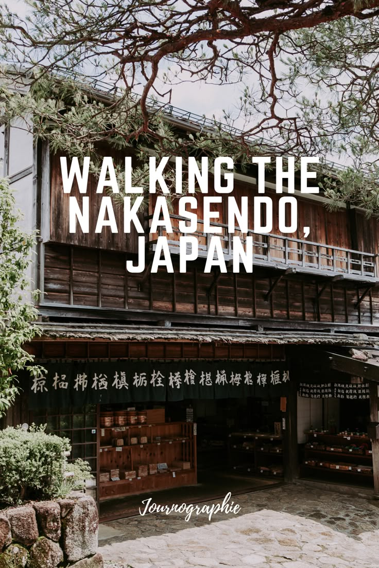 a building with the words walking the nakasendo, japan