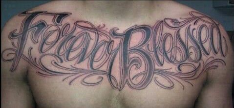 a man's chest with the word fearless written in cursive writing on it