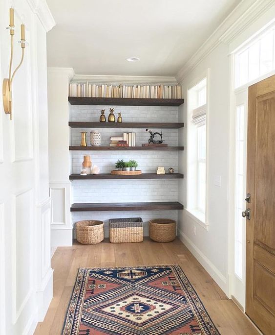 a room with shelves and baskets on the floor