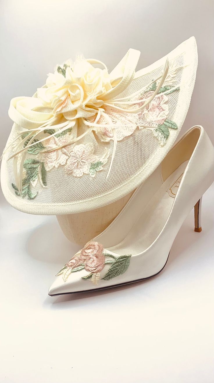 Stunning Hand Finished Ivory Cream with Blush Soft Pink and Sage Green Embroidered Flowers Wedding Satin Bridal Shoes and Matching Hat Very Elegant Set Perfect Wedding Day Shoes and Matching Hat Hat attaches with an internal hair clip and/or headband to be easily held in place. Shoes are High for Elegance Perfect for Comfort Heel Height Approx. 8.5cm Sizes: UK 3-7 (EU 36-41) Feminine Cream Wedding Shoes For Spring, Elegant Embroidered Wedding Shoes For Spring, Cream Closed Toe Wedding Shoes For Ceremony, Cream Closed Toe Wedding Shoes, Fitted Cream Bridal Accessories, Cream Pointed Toe Wedding Shoes For Ceremony, Summer Wedding Shoes In Beige, Spring Wedding Beige Shoes, Beige Summer Wedding Shoes