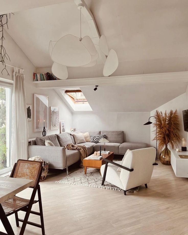 a living room filled with furniture and a flat screen tv