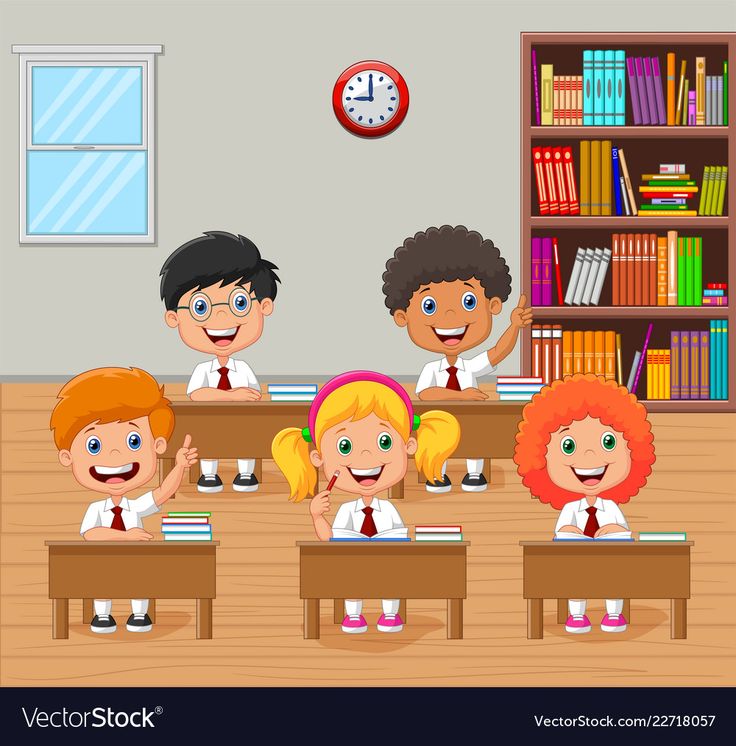 children sitting at desks in classroom with bookshelves and clock on the wall