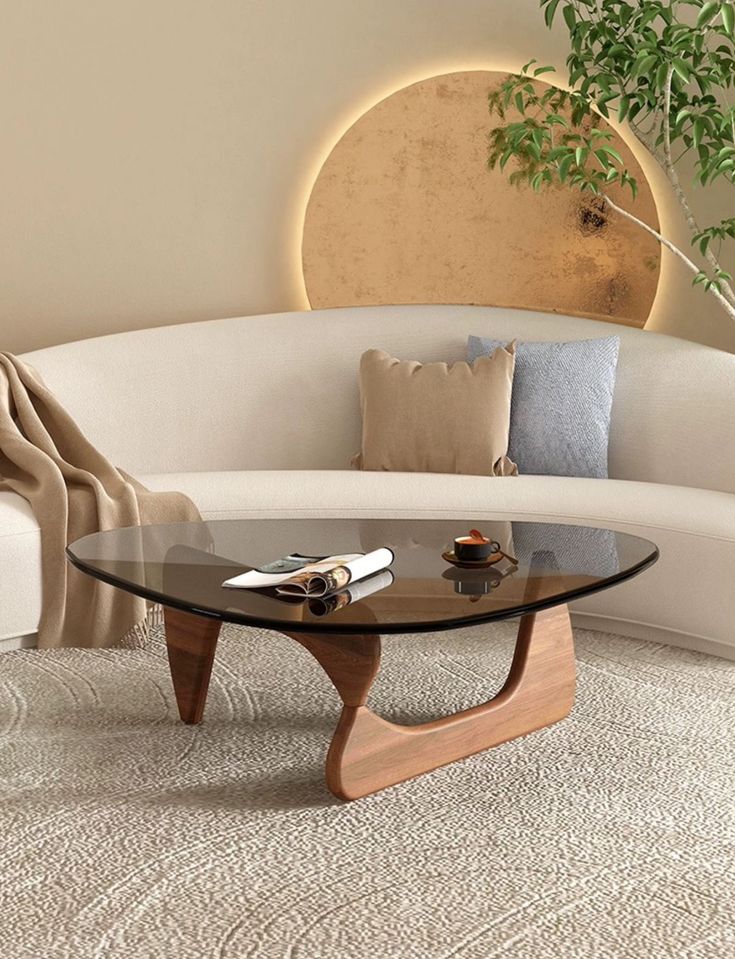 a living room with a white couch and coffee table