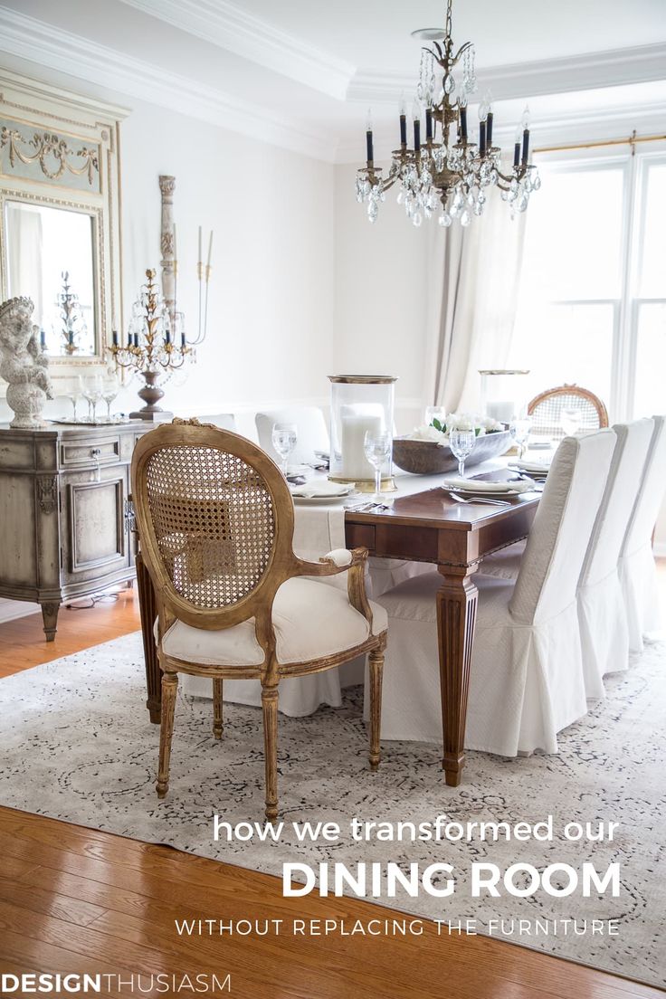 a dining room table with chairs and a chandelier