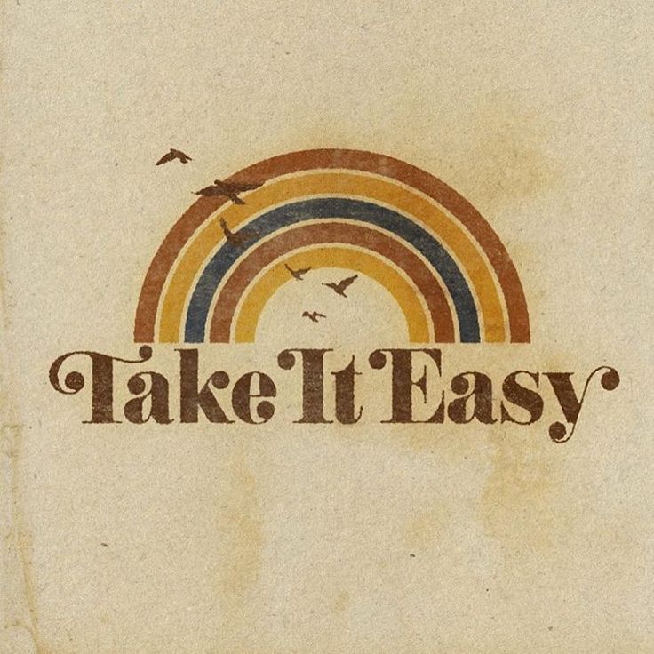 the words take it easy written on a piece of paper with a rainbow in the background