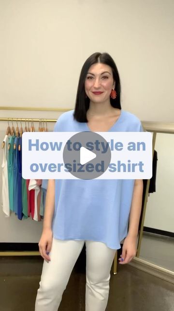 a woman standing in front of a rack of clothes with the words how to style an oversize shirt