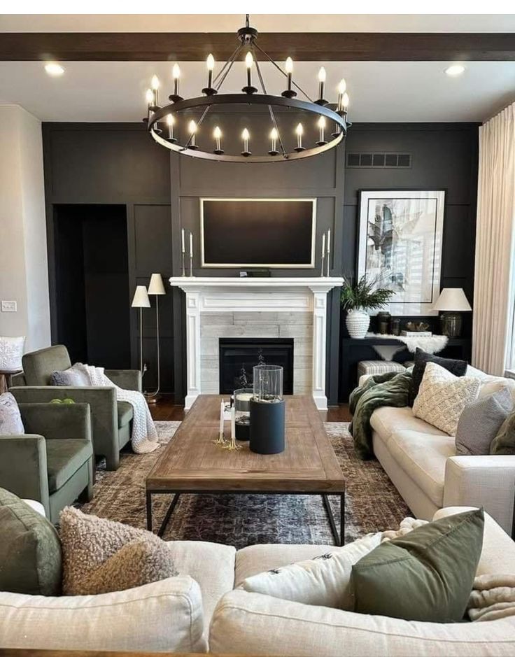 a living room filled with furniture and a flat screen tv mounted on the wall above a fireplace