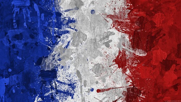 the flag of france is painted on an old, grungy surface with paint splatters