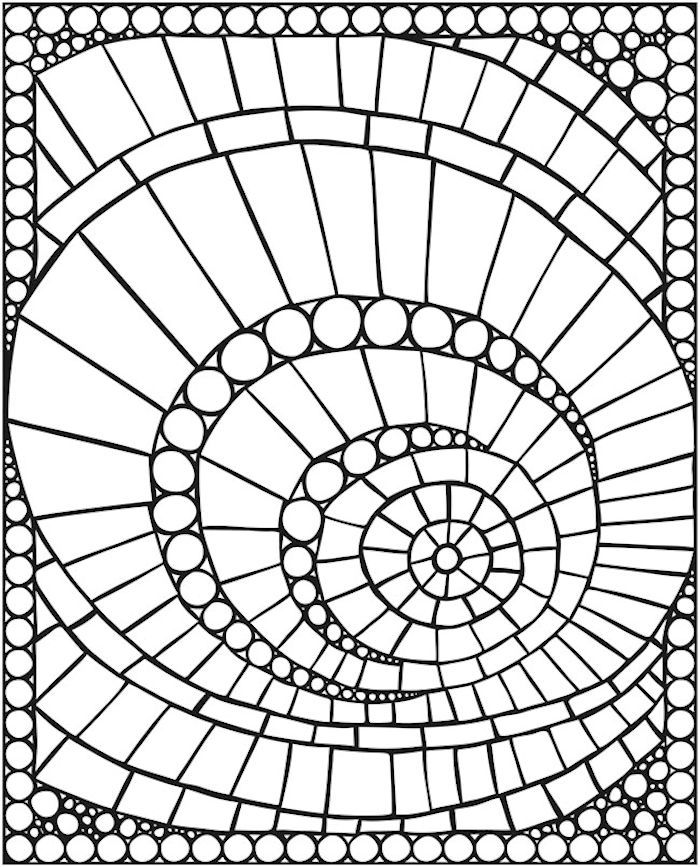 a black and white image of a circular design with circles in the center, on top of