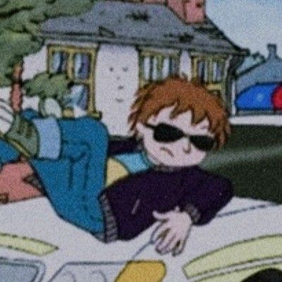 a cartoon character laying on the hood of a car in front of a police officer