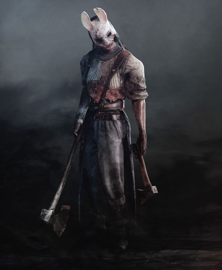 a man with an animal mask holding two shovels in his hand and standing on a dark background