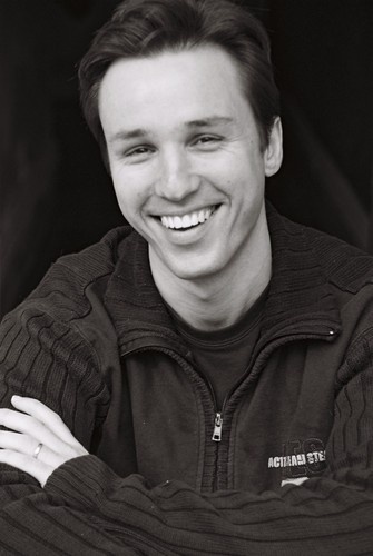 black and white photograph of a smiling man