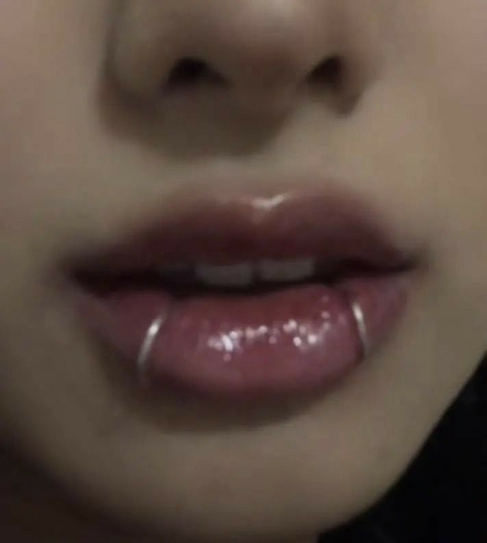 a close up of a person's lips and nose