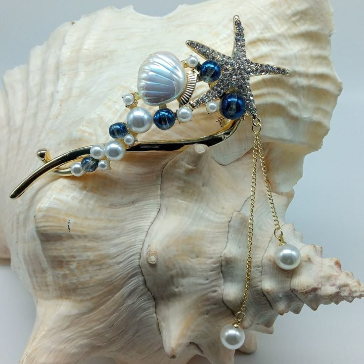 Versatile Hair Clip Beautiful Enough To Be Considered Jewelry Spring Joint For Secure Closure Serrated Projections For Stability And Hold In Desired Placement Jeweled Starfish Iridescent Clam Shell Five Iridescent Blue Beads Ten Mounted Faux Pearls Two Faux Pearls Graduated & Attached By Gold Tone Chain With Movement Medium Weight Pictures Do Not Do This Beauty Justice! Beach Mermaid Coastal Pacific Southwest Nautical Vacation Party Boho Sturdy High Quality Approximately 4 1/2" In Length Blue Hair Accessories For Summer Gift, Elegant Summer Beach Hair Accessories, Seashells Hair Accessories, Ocean Accessories, Weight Pictures, Sea Hair, Ocean Hair, Seashell Crown, Sea Treasure