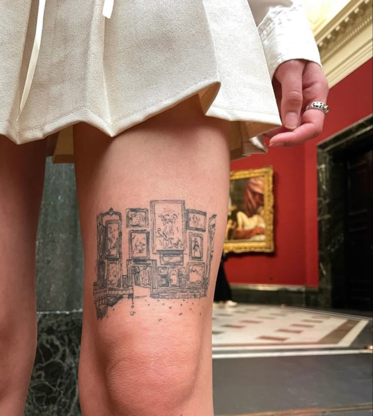 a woman with a tattoo on her leg