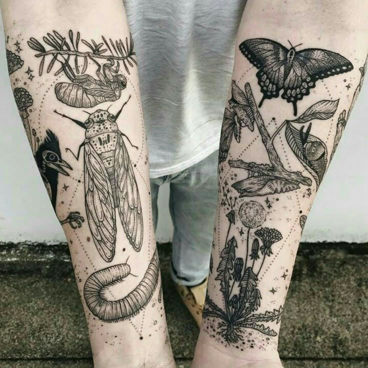 two people with tattoos on their legs, one is holding a butterfly and the other has moths