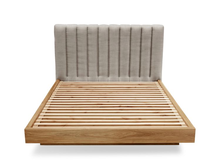 a wooden bed frame with an upholstered headboard