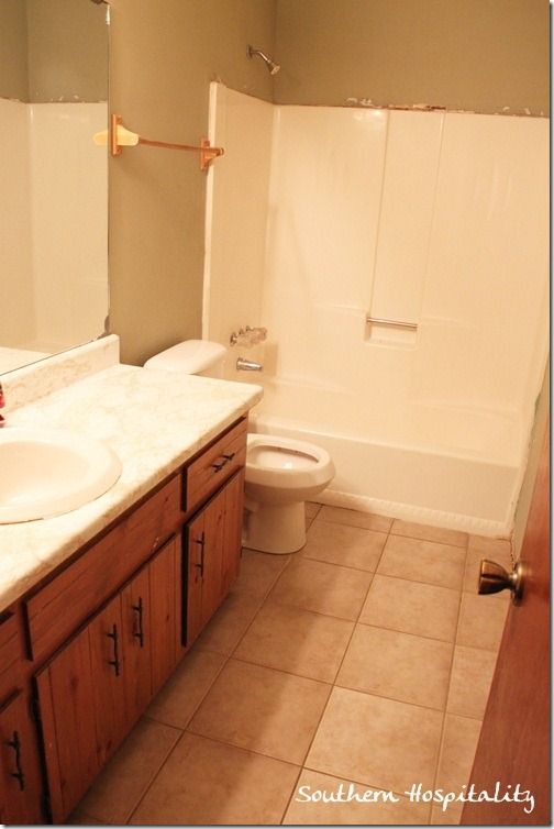 a bathroom with a sink, toilet and bathtub