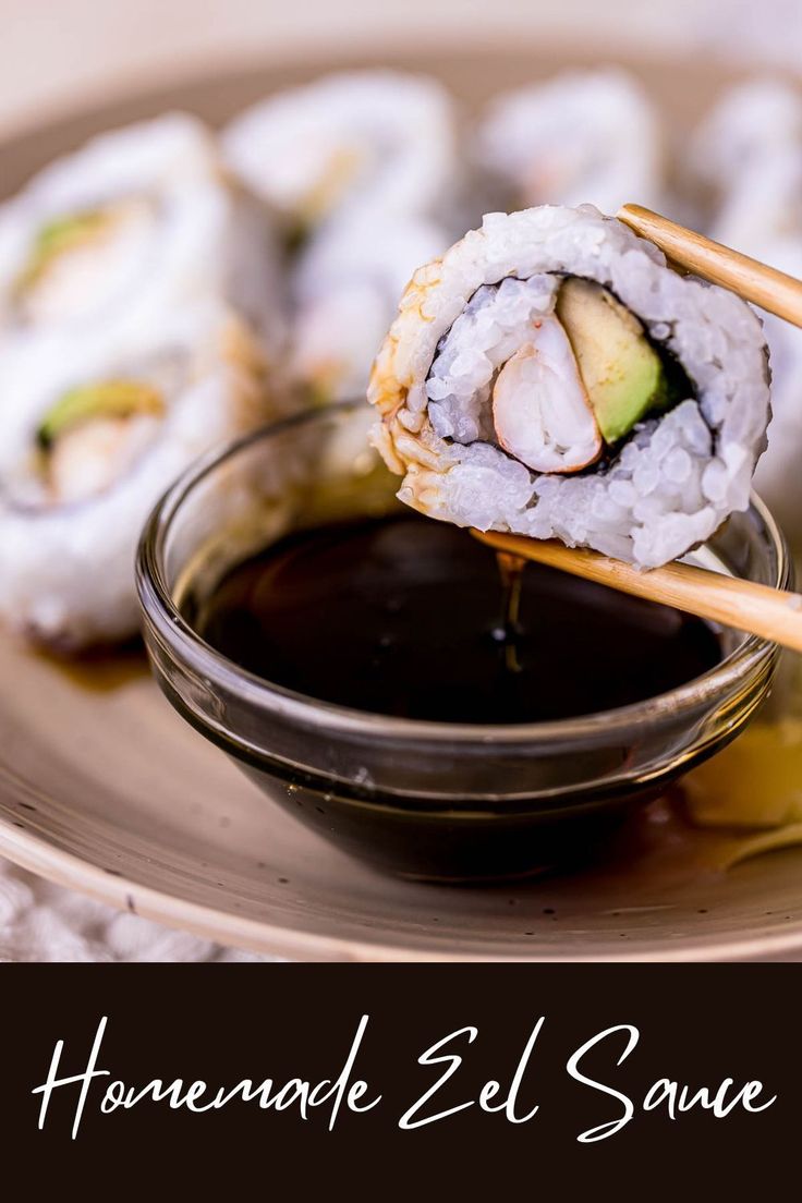 a plate topped with sushi and dipping sauce