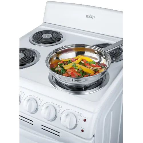 a white stove top oven with a pan on it's burner and food inside