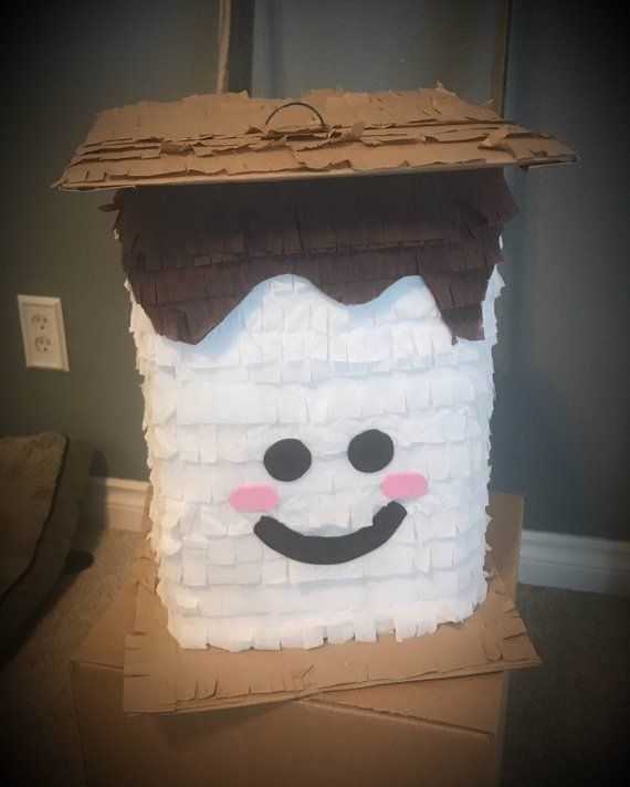 a paper mache house made to look like a snowman