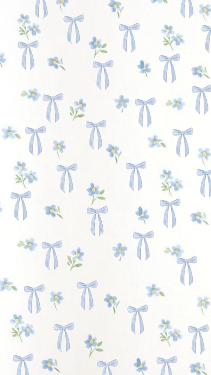 a white wall with blue flowers and bows on it