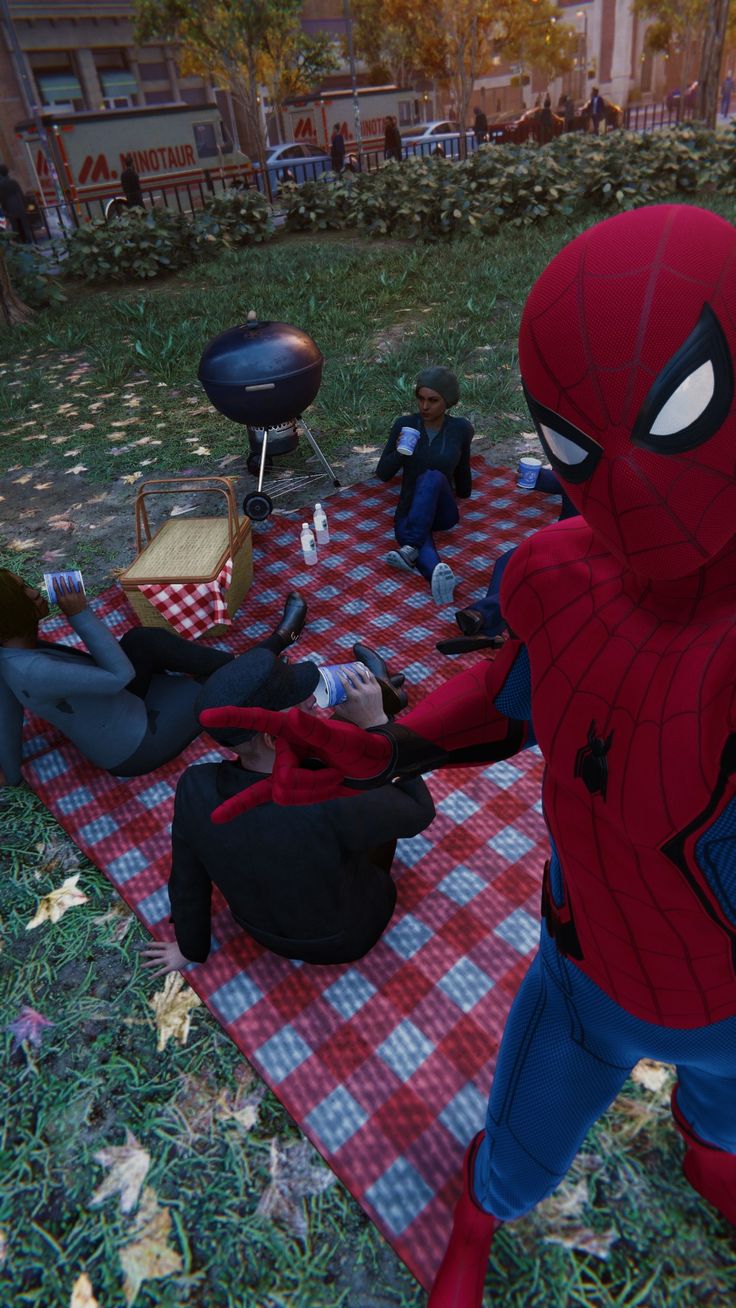 the spider - man is having a picnic with his friends