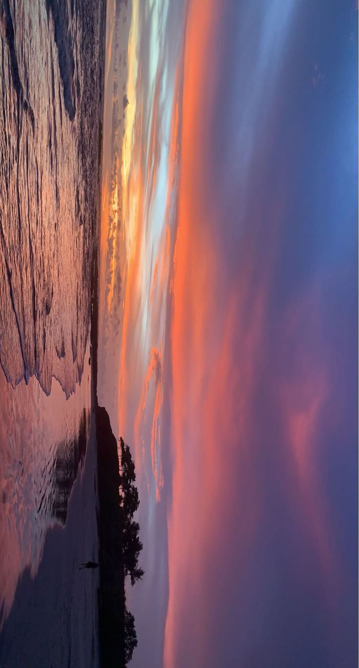 the sky is reflected in the water as it looks like clouds are coming up from the ground