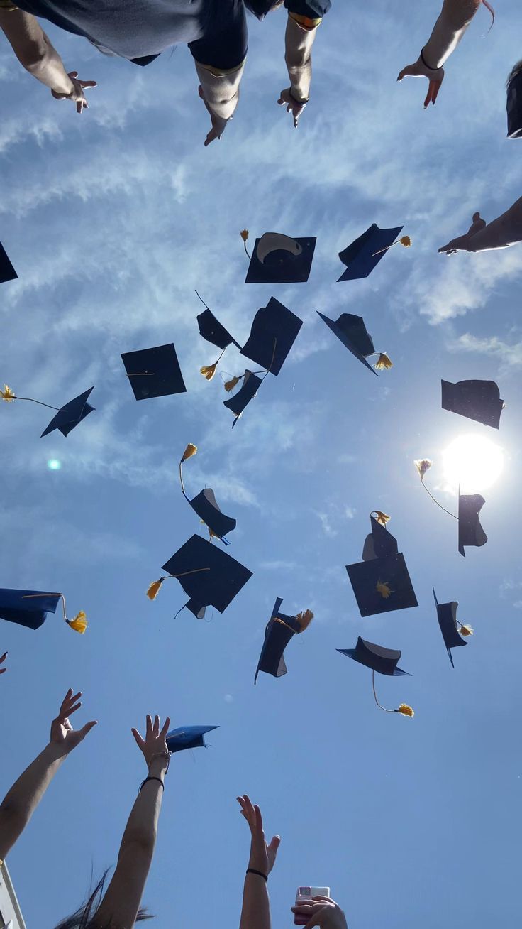 many graduates are throwing their caps in the air