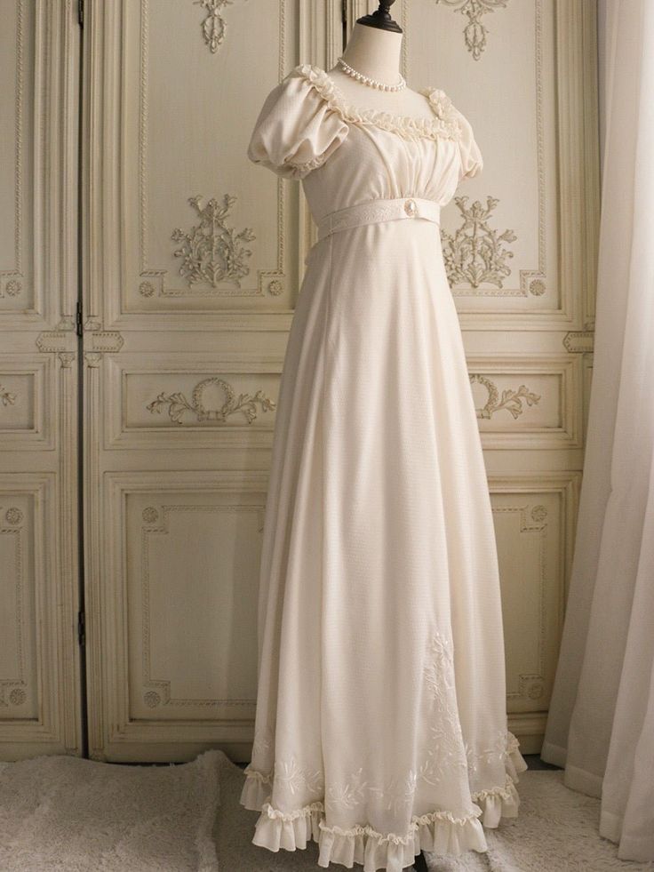 Immerse yourself in the elegance of the Regency era with this exquisite cream Bridgerton-inspired dress. Perfect for brides and special occasions, this gown combines vintage charm with luxurious details, making it a timeless addition to your wardrobe. Elegant Design: Featuring a classic Regency silhouette, this dress boasts puffed sleeves and a gracefully flowing skirt. The delicate chiffon ruffles and floral appliqués add a touch of romantic charm, while the beaded embellishments enhance its so Regency Era Nightgown, Regency Nightgown, Regency Silhouette, Regency Era Dress, Regency Dresses, Nontraditional Wedding Dress, Wedding Dresses High Low, Floral Applique Dress, Bridgerton Inspired