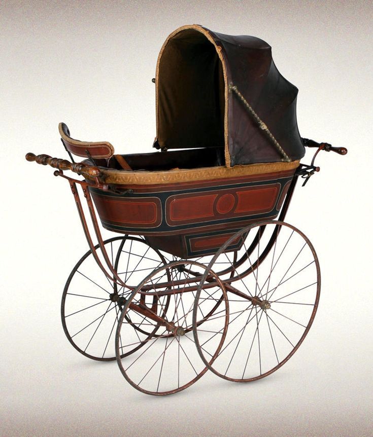 an old fashioned baby carriage is shown on a white background