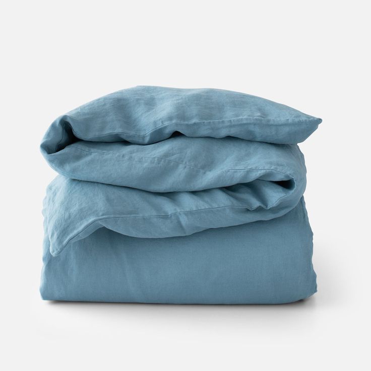 three blue sheets stacked on top of each other