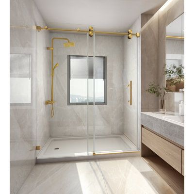 a bathroom with a walk in shower next to a sink and a mirror on the wall