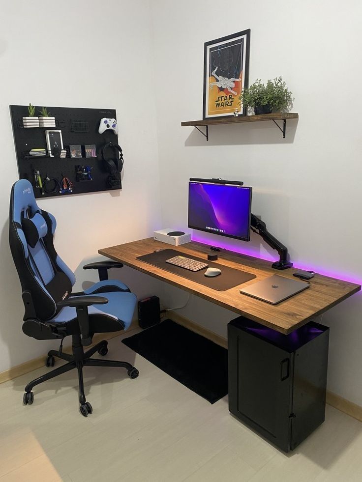 a computer desk with two monitors and a keyboard on it in an office space that has white walls