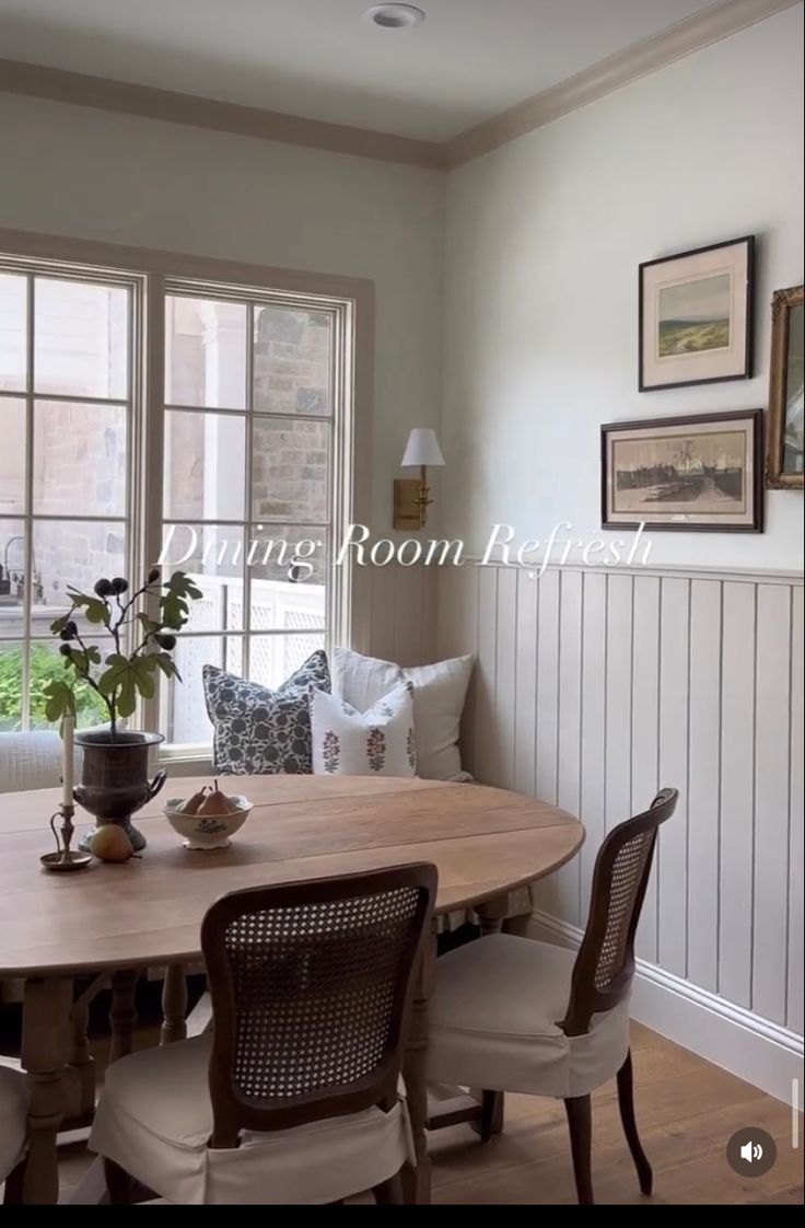 a dining room table with chairs around it