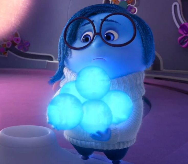 an animated character with blue hair and glasses holding a glowing light up ball in his hand