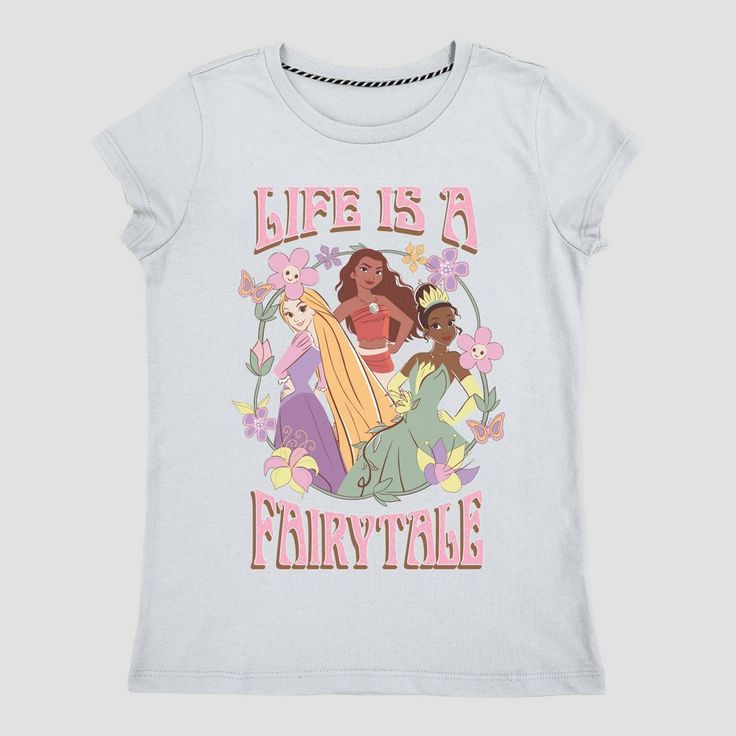 Cute and colorful, this Disney Princess 'Life is a Fairytale' Graphic T-Shirt will be your child's new go-to pick for everyday wear. The light blue pullover tee is elevated by the beautiful artwork of Disney princesses Moana, Tiana and Rapunzel within a floral wreath frame and the pink-lettered 3D-like text that reads "Life is a Fairytale." Made of midweight jersey fabric, this tagless T-shirt tailored with a loose fit that hits at the hip will help them stay comfortable during any activity. Disney Shirts For Kids, Tiana And Rapunzel, Sassy Princess, Cute Disney Shirts, Disney Princess Toddler, Disney Princess Moana, Disney Princess Shirts, Princess Life, Disney Princess Belle