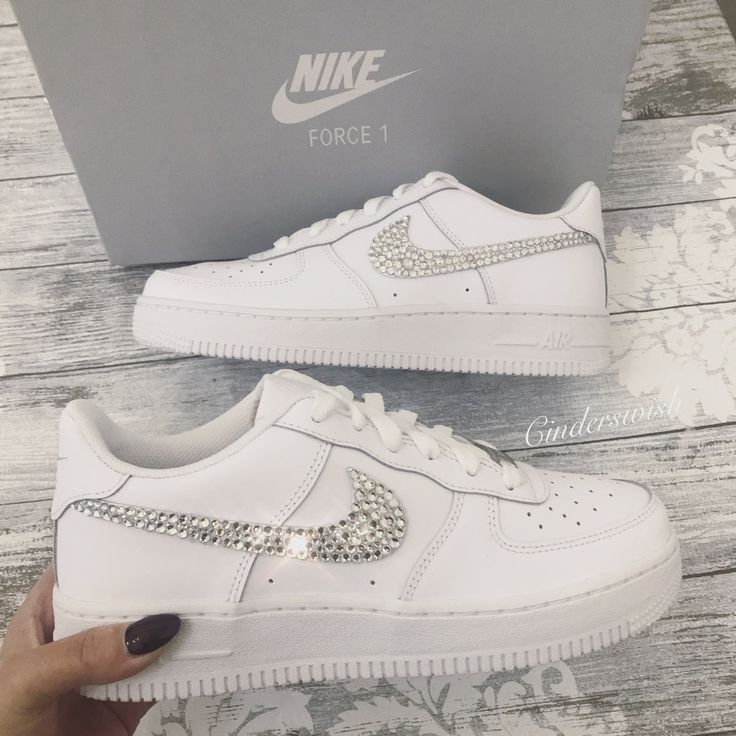 Authentic and Classic Nike Air Force One trainers beautifully hand embellished with genuine Swarvoski crystals on the Classic ticks. All the crystals are lovingly placed to ensure the maximum sparkle on this stunning style.  Available with two OR four ticks sparkled. Luxury Bedazzled White Sneakers, Bedazzled Air Force Ones, Zapatillas Nike Air Force, Teen Shoes, Bling Nike Shoes, Swarovski Nike, Nike Air Force One, Nike Air Force 1s, Custom Nike