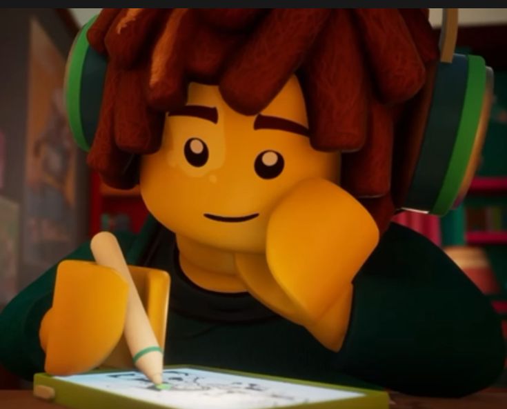 a lego character sitting at a table with a pen and paper